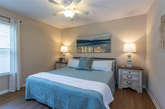115 N Coopers Hawk Way, Palm Coast, FL 32164 - bedroom with wood finished floors, baseboards, and a ceiling fan