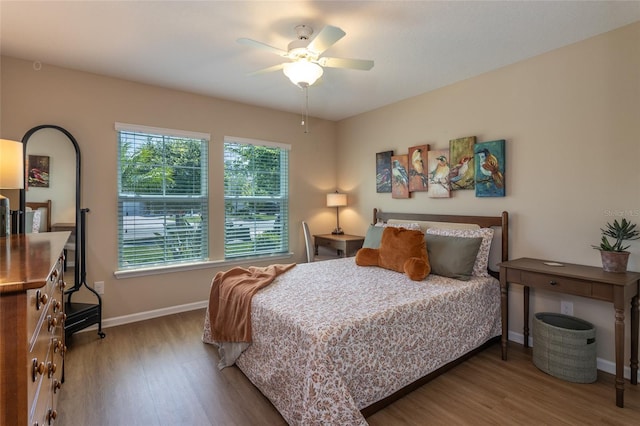 115 N Coopers Hawk Way, Palm Coast, FL 32164 - bedroom featuring wood finished floors, baseboards, and ceiling fan