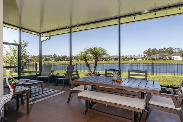 115 N Coopers Hawk Way, Palm Coast, FL 32164 - sunroom / solarium with a water view, outdoor dining area, and a residential view