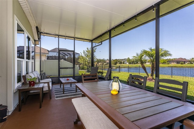 115 N Coopers Hawk Way, Palm Coast, FL 32164 - sunroom with a water view and outdoor dining space