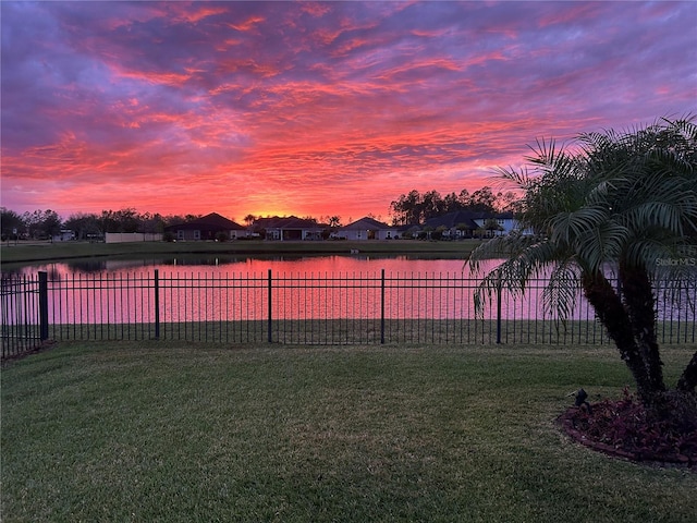 115 N Coopers Hawk Way, Palm Coast, FL 32164 - yard at dusk featuring a water view