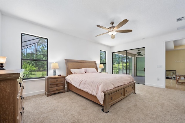 27 Bay Ct, Ormond Beach, FL 32174 - bedroom featuring multiple windows, baseboards, and light carpet