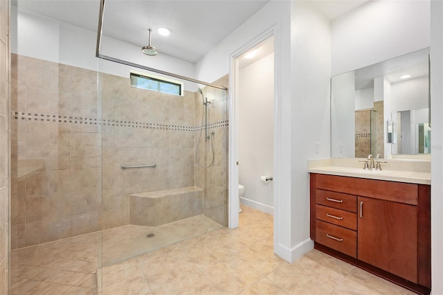 27 Bay Ct, Ormond Beach, FL 32174 - bathroom with tiled shower, vanity, toilet, baseboards, and tile patterned floors