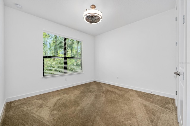 27 Bay Ct, Ormond Beach, FL 32174 - unfurnished room featuring carpet, baseboards, and a smoke detector