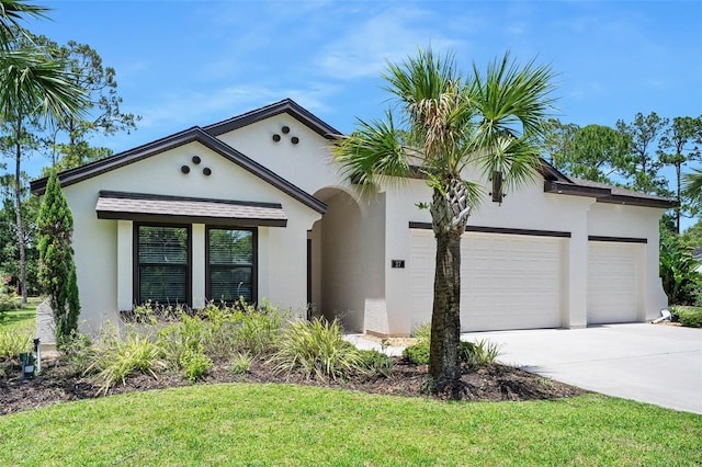 27 Bay Ct, Ormond Beach, FL 32174 - view of front of home featuring an attached garage, driveway, stucco siding, and a front lawn