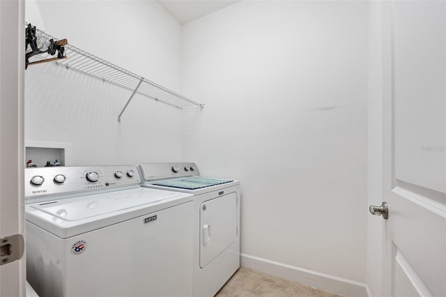 27 Bay Ct, Ormond Beach, FL 32174 - laundry area with independent washer and dryer and baseboards