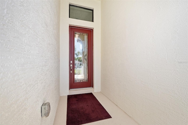 27 Bay Ct, Ormond Beach, FL 32174 - doorway to property with stucco siding