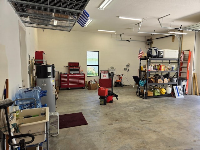 27 Bay Ct, Ormond Beach, FL 32174 - garage featuring water heater and concrete block wall