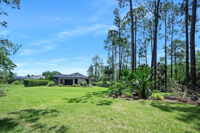 27 Bay Ct, Ormond Beach, FL 32174 - view of grassy yard with a lanai