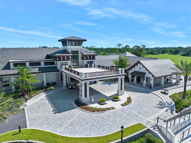 27 Bay Ct, Ormond Beach, FL 32174 - back of house with curved driveway and stairway