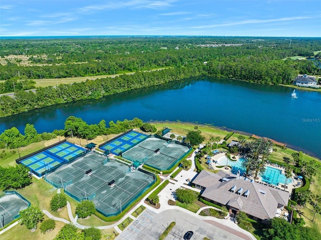 27 Bay Ct, Ormond Beach, FL 32174 - bird's eye view of a forest, a nearby body of water, and a pool area