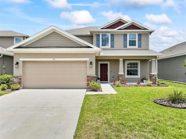 40 Oakleaf Way, Palm Coast, FL 32137 - craftsman-style home featuring driveway, a front yard, stucco siding, a garage, and a porch