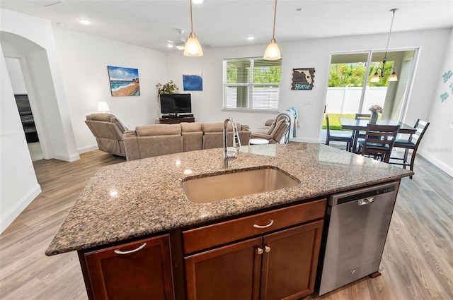 40 Oakleaf Way, Palm Coast, FL 32137 - kitchen featuring stainless steel dishwasher, a sink, arched walkways, light wood-style floors, and recessed lighting