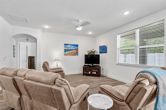 40 Oakleaf Way, Palm Coast, FL 32137 - living area with light wood-type flooring, baseboards, ceiling fan, recessed lighting, and a textured ceiling