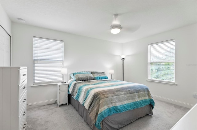 40 Oakleaf Way, Palm Coast, FL 32137 - bedroom featuring baseboards, light colored carpet, and ceiling fan