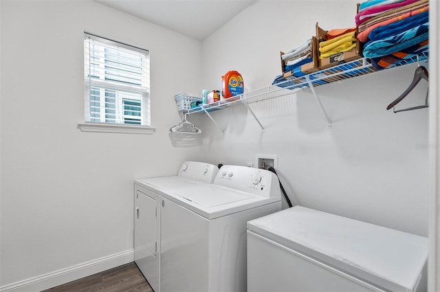 40 Oakleaf Way, Palm Coast, FL 32137 - laundry area with washer and dryer, dark wood finished floors, and baseboards