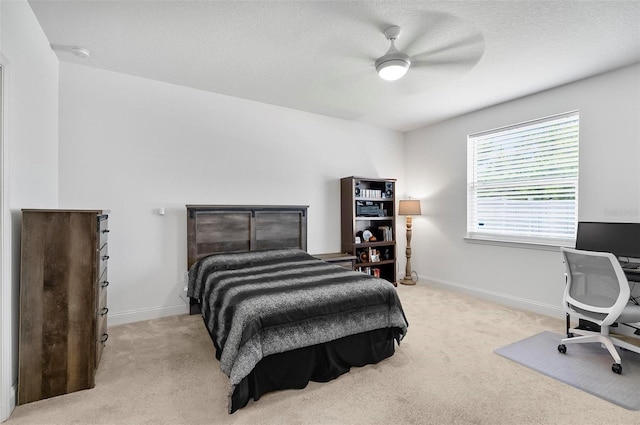40 Oakleaf Way, Palm Coast, FL 32137 - bedroom with light colored carpet, baseboards, a desk, and a ceiling fan