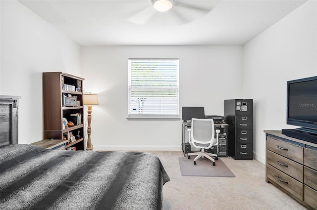 40 Oakleaf Way, Palm Coast, FL 32137 - bedroom with baseboards, light carpet, ceiling fan, and a desk