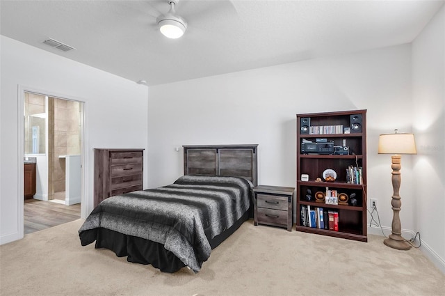 40 Oakleaf Way, Palm Coast, FL 32137 - bedroom with carpet flooring, baseboards, and ensuite bathroom