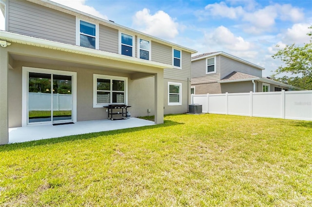 40 Oakleaf Way, Palm Coast, FL 32137 - back of house featuring a patio, stucco siding, and central AC