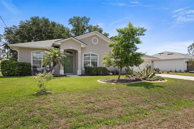 11 Roxboro Dr, Palm Coast, FL 32164 - ranch-style house with stucco siding, a garage, concrete driveway, and a front yard