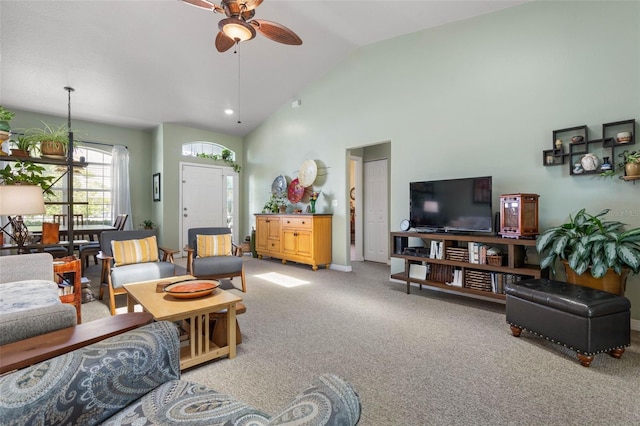 11 Roxboro Dr, Palm Coast, FL 32164 - living room with light colored carpet, ceiling fan, baseboards, and high vaulted ceiling