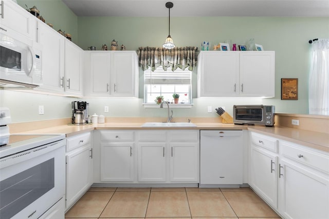 11 Roxboro Dr, Palm Coast, FL 32164 - kitchen with white appliances, a sink, white cabinetry, pendant lighting, and light tile patterned floors