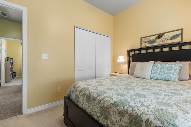 11 Roxboro Dr, Palm Coast, FL 32164 - bedroom with light carpet, a closet, and baseboards