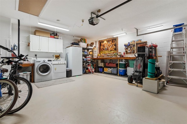 11 Roxboro Dr, Palm Coast, FL 32164 - garage with washer and clothes dryer, freestanding refrigerator, a garage door opener, and a workshop area