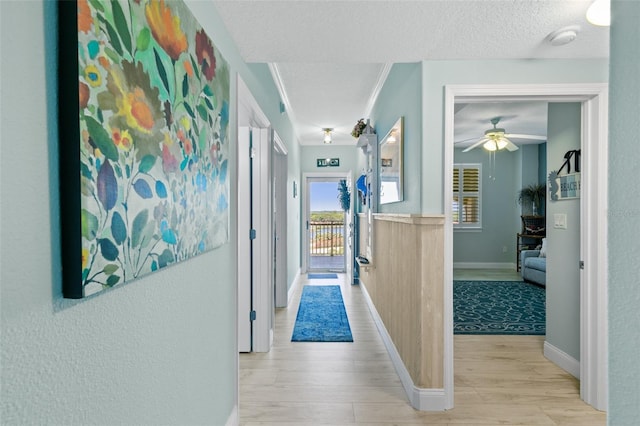 80 Surfview Dr Unit 721, Palm Coast, FL 32137 - hall featuring wood finished floors and a textured ceiling