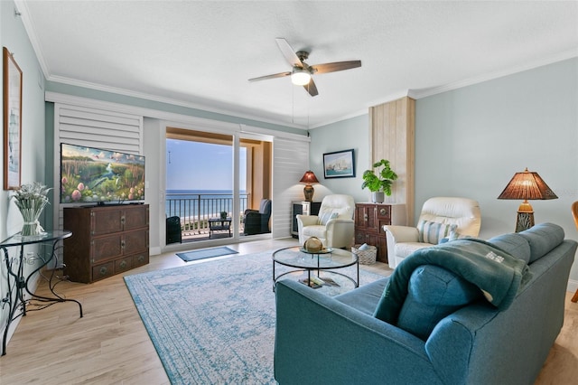 80 Surfview Dr Unit 721, Palm Coast, FL 32137 - living room featuring ceiling fan, wood finished floors, crown molding, and a textured ceiling
