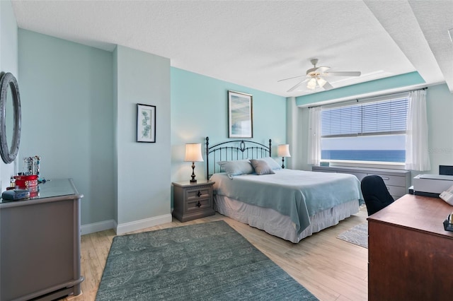 80 Surfview Dr Unit 721, Palm Coast, FL 32137 - bedroom featuring light wood-style floors, a textured ceiling, ceiling fan, and an office area