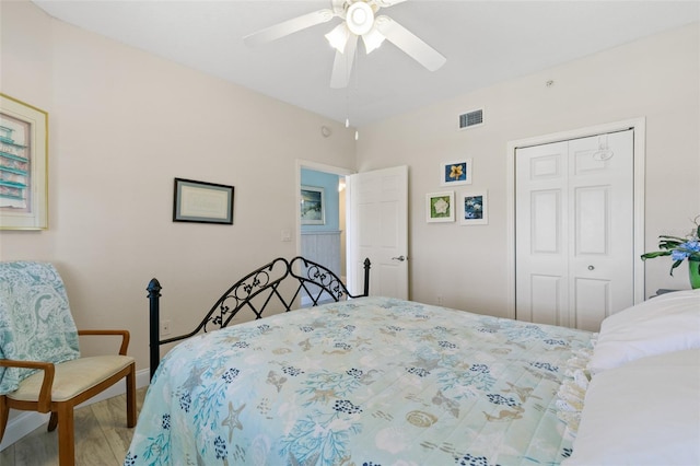 80 Surfview Dr Unit 721, Palm Coast, FL 32137 - bedroom with wood finished floors, a closet, and a ceiling fan
