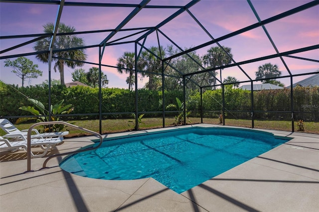 7 White Oak Ln, Palm Coast, FL 32164 - pool at dusk featuring an outdoor pool, a patio, and glass enclosure