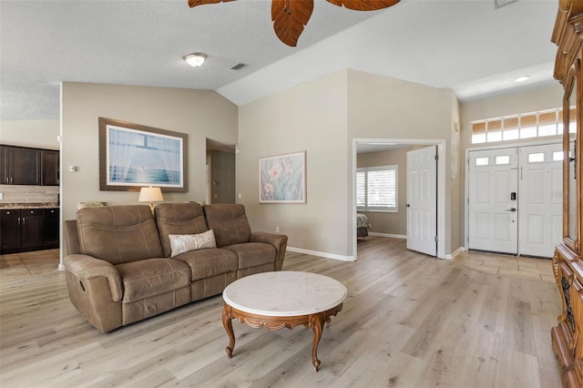 7 White Oak Ln, Palm Coast, FL 32164 - living area with ceiling fan, light wood finished floors, baseboards, and vaulted ceiling