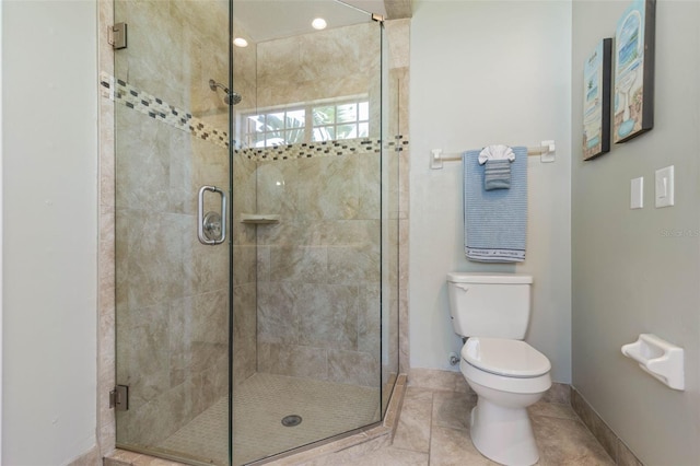 7 White Oak Ln, Palm Coast, FL 32164 - bathroom with a shower stall, toilet, baseboards, and tile patterned flooring