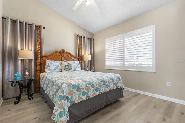 7 White Oak Ln, Palm Coast, FL 32164 - bedroom with lofted ceiling, light wood-style flooring, baseboards, and a ceiling fan