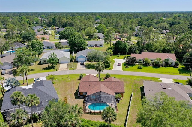 7 White Oak Ln, Palm Coast, FL 32164 - aerial view of residential area featuring a pool and a heavily wooded area