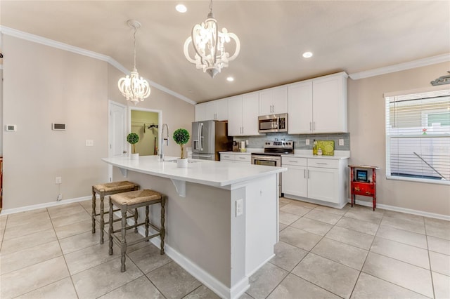 574 Seville Pkwy, Saint Augustine, FL 32086 - kitchen featuring appliances with stainless steel finishes, a chandelier, a sink, light tile patterned flooring, and tasteful backsplash