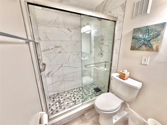 1601 N Central Ave Unit G10, Flagler Beach, FL 32136 - bathroom with toilet, a shower stall, and wood finished floors