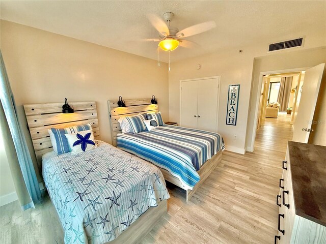 1601 N Central Ave Unit G10, Flagler Beach, FL 32136 - bedroom featuring baseboards, light wood-style floors, and a ceiling fan