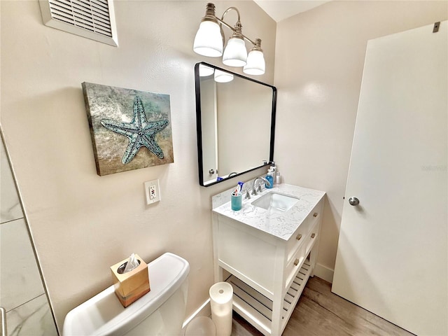 1601 N Central Ave Unit G10, Flagler Beach, FL 32136 - bathroom with vanity, wood finished floors, and toilet