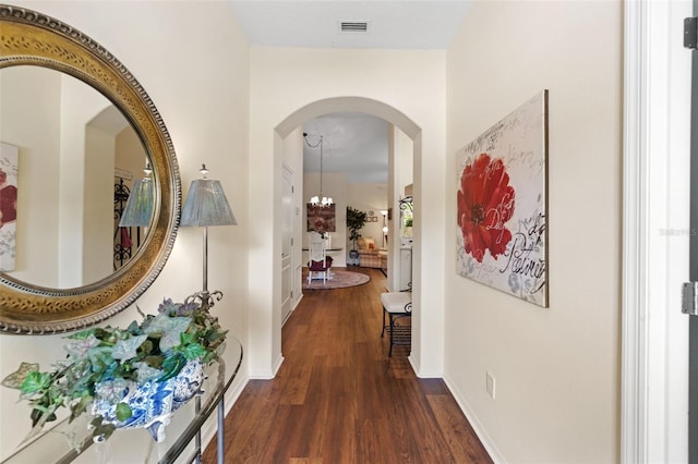 33 Veranda Way Unit 33, Palm Coast, FL 32137 - hall featuring wood finished floors, arched walkways, and baseboards