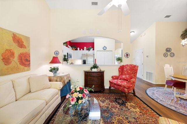 33 Veranda Way Unit 33, Palm Coast, FL 32137 - living room with a high ceiling, wood finished floors, ceiling fan, and baseboards