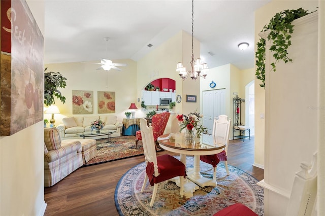 33 Veranda Way Unit 33, Palm Coast, FL 32137 - dining room featuring a ceiling fan, arched walkways, wood finished floors, a chandelier, and high vaulted ceiling