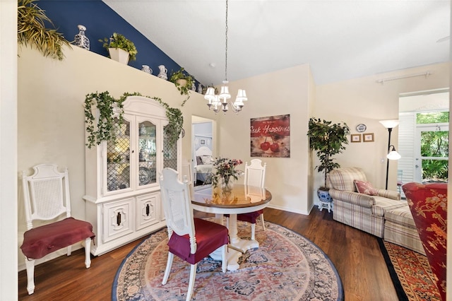 33 Veranda Way Unit 33, Palm Coast, FL 32137 - dining space featuring a chandelier, wood finished floors, high vaulted ceiling, and baseboards