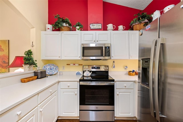 33 Veranda Way Unit 33, Palm Coast, FL 32137 - kitchen with stainless steel appliances, light countertops, and white cabinetry