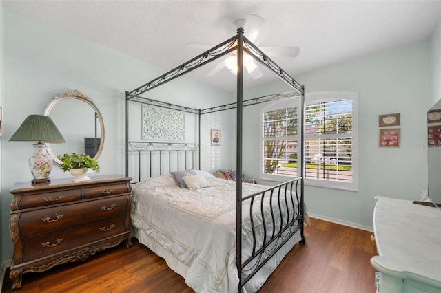 33 Veranda Way Unit 33, Palm Coast, FL 32137 - bedroom with dark wood finished floors, ceiling fan, and baseboards