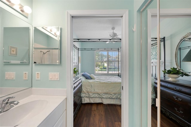 33 Veranda Way Unit 33, Palm Coast, FL 32137 - ensuite bathroom featuring wood finished floors, vanity, and ceiling fan