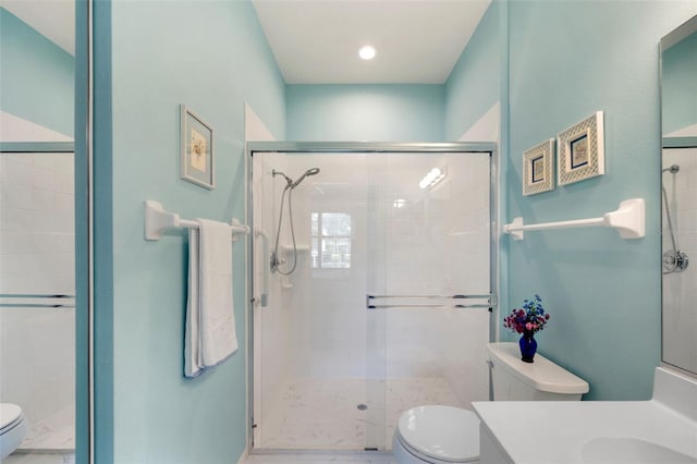 33 Veranda Way Unit 33, Palm Coast, FL 32137 - full bathroom with toilet, vanity, a shower stall, marble look tiles, and recessed lighting